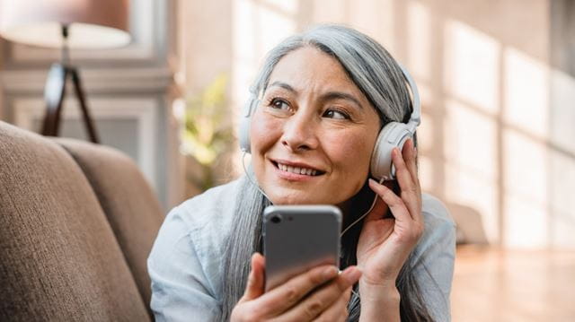Woman listening to headphones